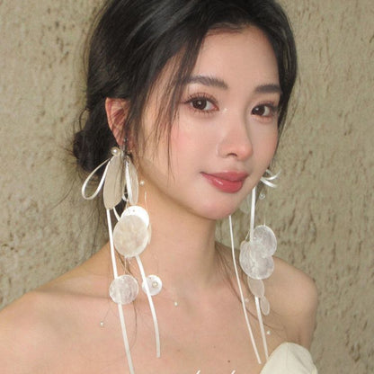 Long earrings with white circular pieces