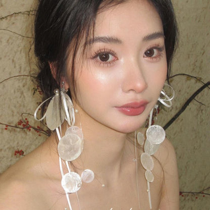 Long earrings with white circular pieces